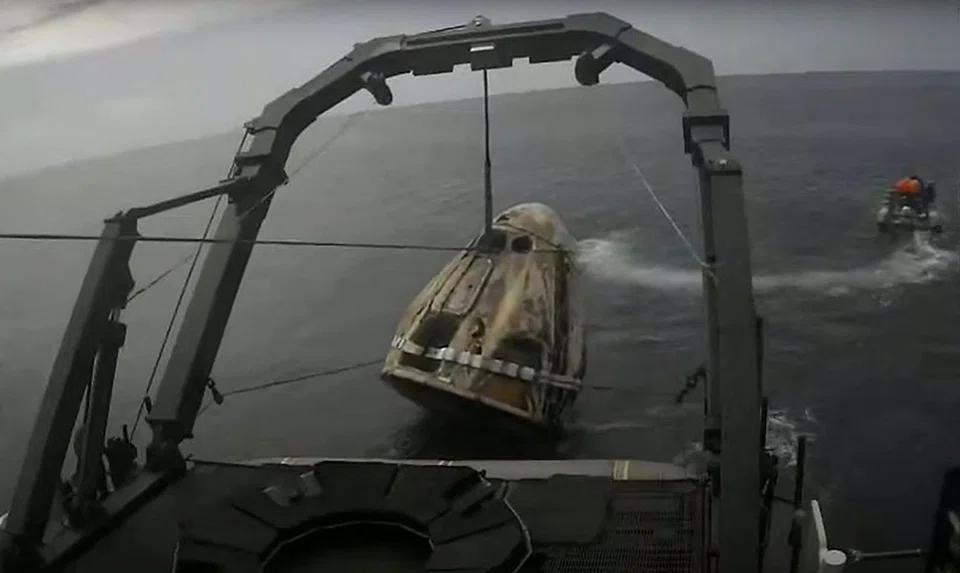 This screengrab from a Nasa TV broadcast shows the crew Dragon capsule Endeavour recovery after splashing down in the Atlantic Ocean with the Axiom Space Ax-1 crew on April 25, 2022. 