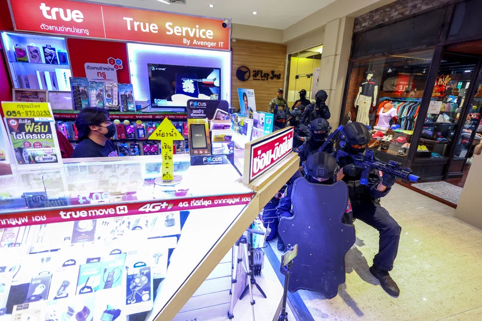 Special force police officers take part in a simulation exercise in Bangkok ahead of the Apec Summit in November. 
