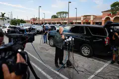 Peter Navarro talks to the media before turning himself in at a federal correctional institution to begin his prison sentence for defying a subpoena from a panel that investigated the Jan 6, 2021, attack on the US Capitol, in Miami, Florida,  March 19, 2024. 