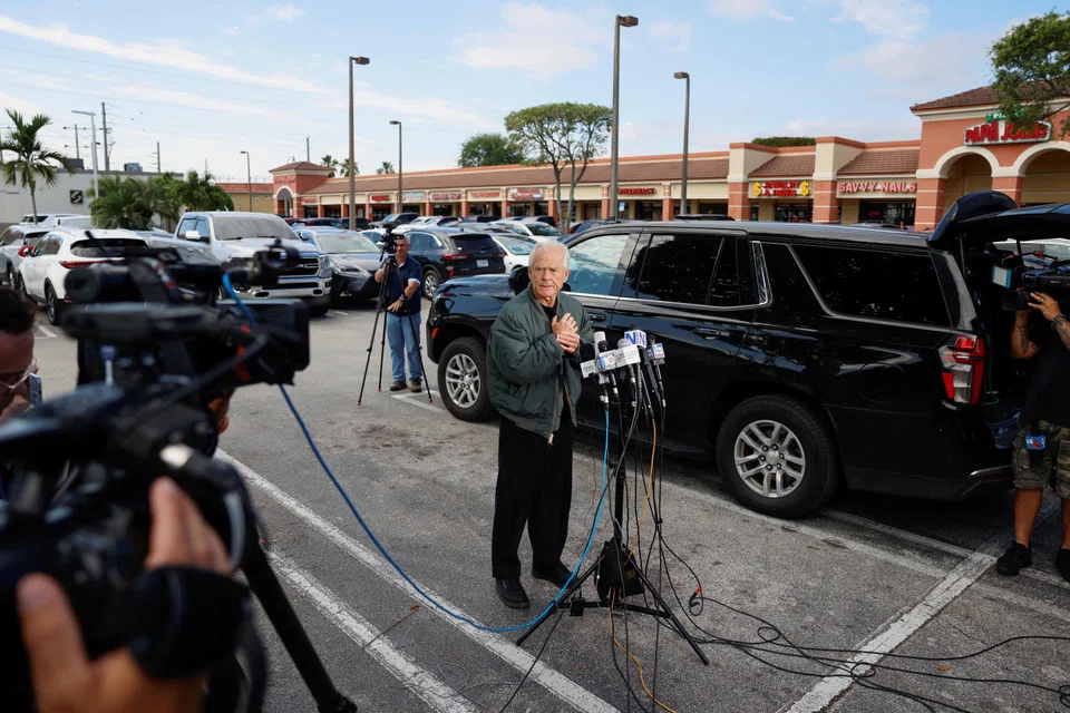 Peter Navarro talks to the media before turning himself in at a federal correctional institution to begin his prison sentence for defying a subpoena from a panel that investigated the Jan 6, 2021, attack on the US Capitol, in Miami, Florida,  March 19, 2024. 