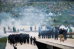 Supporters of Brazil's former President Jair Bolsonaro demonstrate against President Luiz Inacio Lula da Silva while security forces operate, outside Brazil’s National Congress in Brasilia, Brazil, Jan 8, 2023.