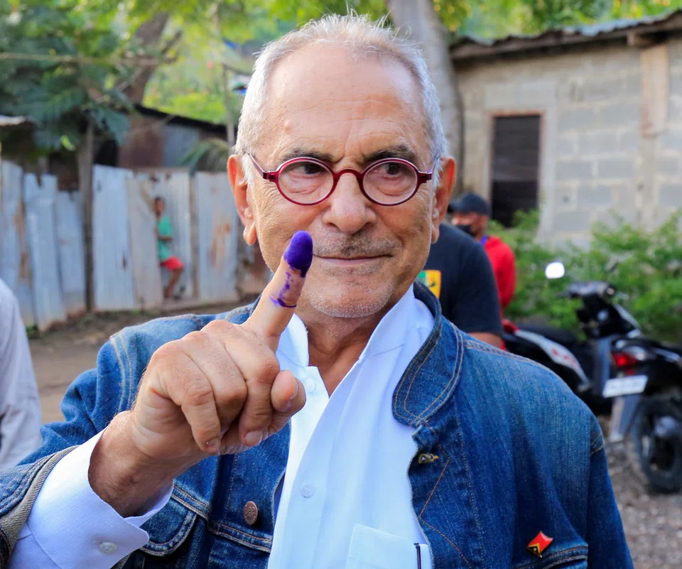 East Timor presidential candidate Jose Ramos Horta shows his inked finger after casting his ballot during the second round of East Timor's presidential election in Dili, East Timor, April 19, 2022. 