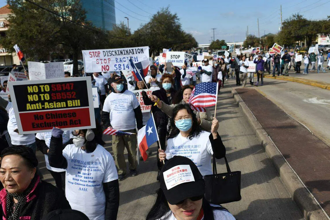 Demonstrators hold a protest in Houston, Texas, against a bill that would forbid Chinese nationals from buying properties in Texas, on Feb 11, 2023. 