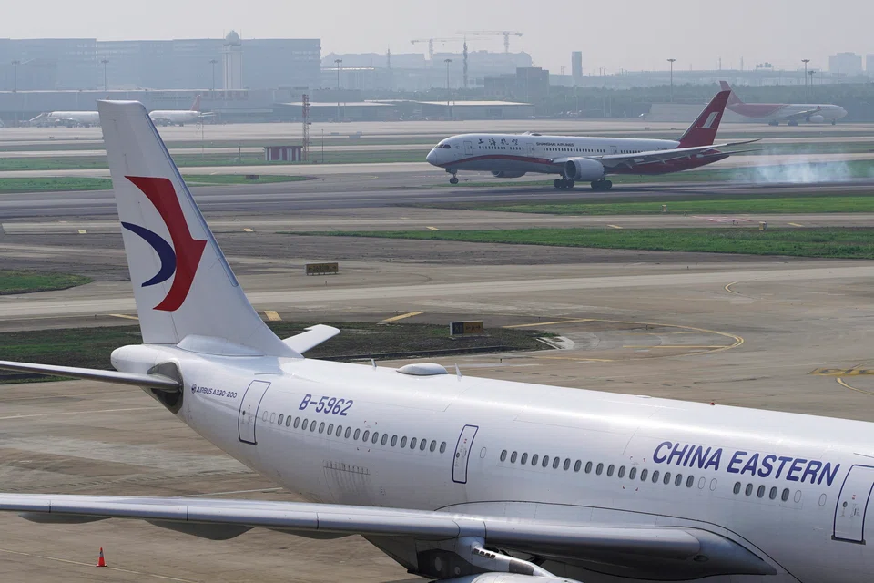 Online searches for air tickets on international routes with China surged after Beijing unexpectedly said it would slash  Covid-19 quarantine norms.