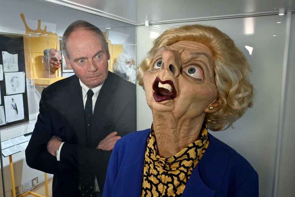 John Lloyd with a puppet figure depicting Britain's late Conservative Prime Minister Margaret Thatcher at the exhibition, which opened on Saturday (Sep 30) at Cambridge University Library.