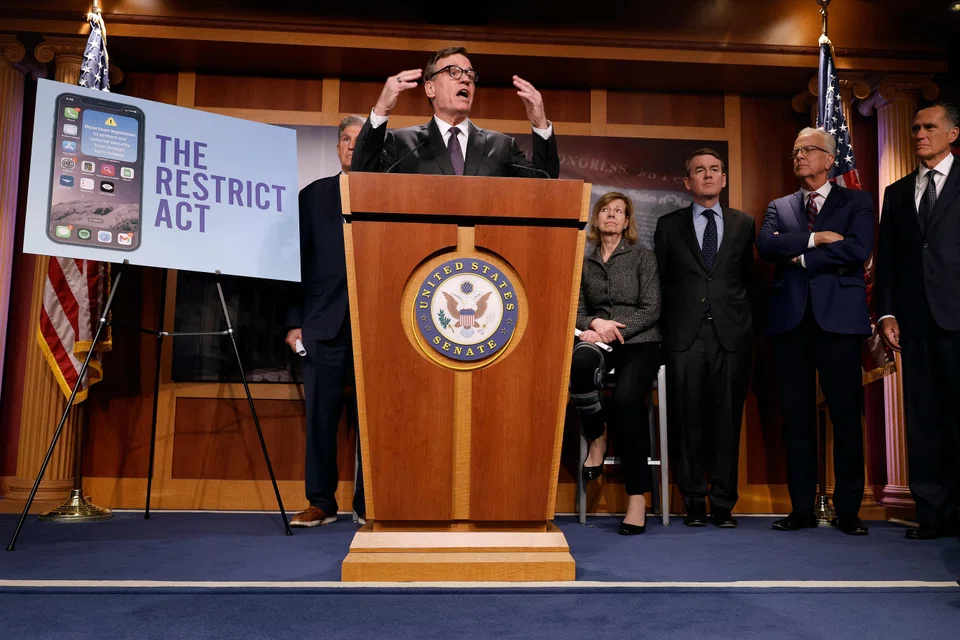 US Senate Select Committee on Intelligence Chairman Mark Warner talks to reporters while introducing the Restrict Act at the US Capitol on March 07, 2023 in Washington, DC. in reaction to software built in countries hostile to the United States, including China's TikTok.