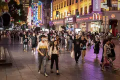 Shoppers and pedestrians walk along a street in Shanghai. Chinese consumers are choosing local brands for their quality and innovation and not just for cheaper prices, or out of a sense of national pride, said McKinsey.