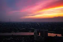 The skylines of Tokyo and Ichikawa during the evening hour in Ichikawa city, Chiba prefecture, east of Tokyo on June 7, 2023. The country’s power market is predicted to be less tight this summer in most of the regions than last summer when the government asked for energy conservation across the nation, according to the industry ministry’s forecast in May. 