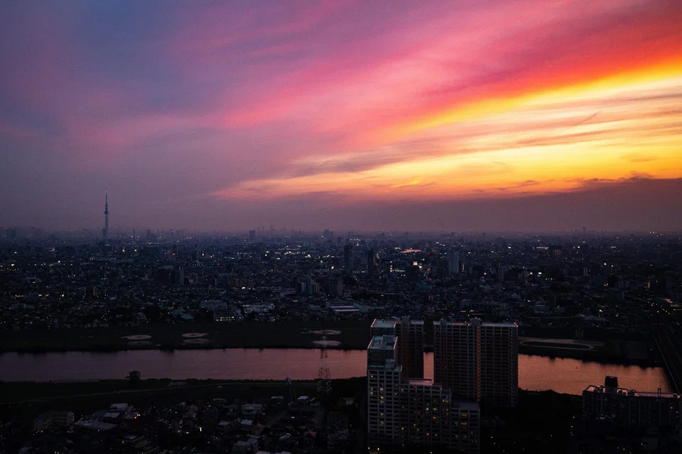 The skylines of Tokyo and Ichikawa during the evening hour in Ichikawa city, Chiba prefecture, east of Tokyo on June 7, 2023. The country’s power market is predicted to be less tight this summer in most of the regions than last summer when the government asked for energy conservation across the nation, according to the industry ministry’s forecast in May. 