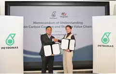 The MOU is is signed by Marina Surzhenko (right), Vopak's commercial, business development and energy transition director and Emry Hisham, Petronas' head of carbon management.