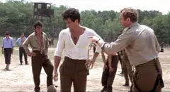 In John Huston’s World War II adventure drama Escape to Victory, Brazilian striker Pele is joined by movie stars and real-life professional footballers from across Europe and North and South America to play ball against Nazi rivals.