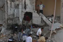 Palestinians inspect the destruction following an Israeli strike in Rafah in the southern Gaza Strip on Dec 1, 2023, as fighting resumed shortly after the expiration of a seven-day truce between Israel and Hamas militants. 
