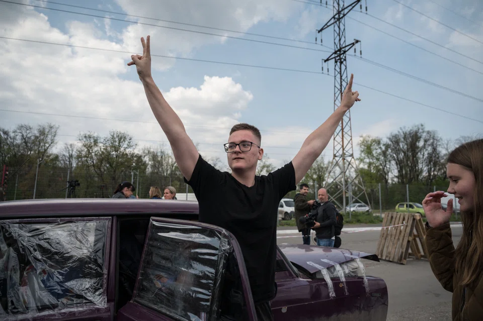 A man gesturing after arriving from the besieged city of Mariupol with his family in their own vehicle, ahead of a humanitarian convoy at a registration and processing area for internally displaced people in Ukraine on May 2.