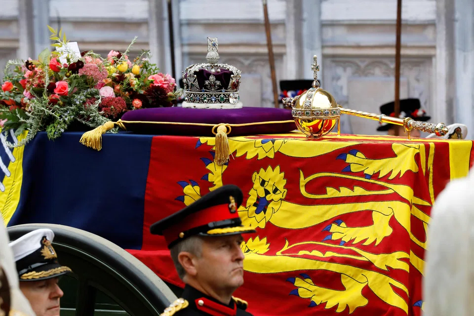 The coffin of Queen Elizabeth II with the Imperial State Crown, along with the orb and sceptre, symbols of her authority, was borne on a gun carriage that made its way to Westminster Abbey for the state funeral on Monday (Sep 19). The cortège then made its way to St George's Chapel in Windsor for interment before a smaller congregation. 