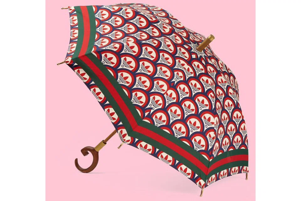 LUXURY label Gucci and sportswear firm Adidas are grabbing headlines in China for selling an 11,100 yuan (S$2,285) umbrella that doesn't even stop rain. Never mind that the brands say that's not what it was designed to do.