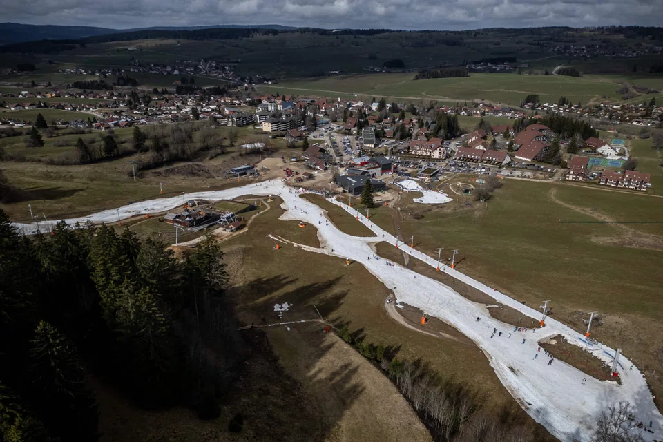 Ski slopes in a snowless landscape at the French Jura ski resort of Metabief, France, Feb 20, 2024. While the El Nino and other effects have played a role in the unprecedented recent heat, scientists stressed that the greenhouse gas emissions that humans continue to pump into the atmosphere were the main culprit.
