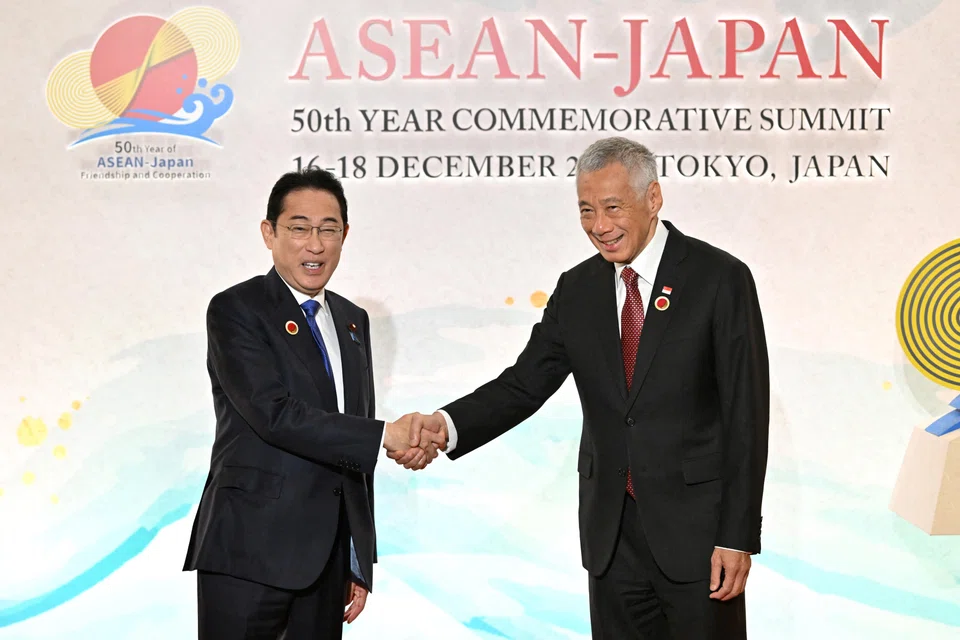 Japan's Prime Minister Fumio Kishida (left) with   PM Lee at the  the opening session of the Asean-Japan Commemorative Summit Meeting at the  Okura Tokyo hotel on Dec 17.