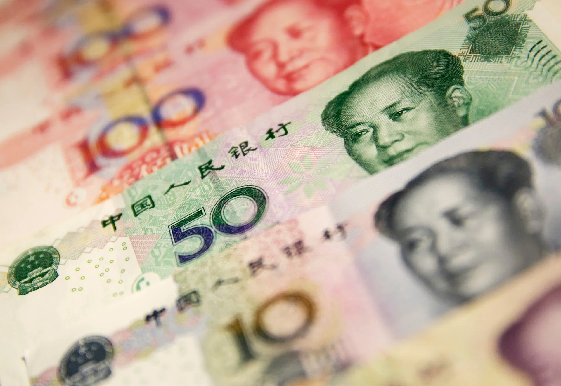 China lets yuan fall faster, share trading suspended as prices tumble - The  Business Times