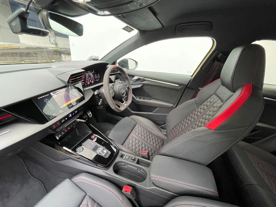 The cabin strikes a similarly racy tone, not least because of the sporty front seats, with their quilted upholstery, coloured stitching and patches of scarlet. 
