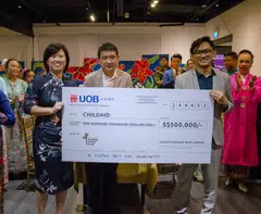 (from left) Ms Janice Leong, Executive Director, Corporate Wealth Management, Commercial Banking, UOB Ltd, presented a cheque donation of $500,000 to ChildAid, represented here by Mr Phan Ming Yen, Chief Operating Officer of The Rice Company Ltd, which manages The Business TImes Budding Artists Fund, and Mr Helmi Yusof, co-chair of the Organising Committee of ChildAid 2022. 