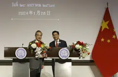 Thai Foreign Minister Parnpree Bahiddha-nukara (right) and his Chinese counterpart Wang Yi signed the mutual visa exemption, which takes effect from Mar 1, at a ceremony after meeting in Bangkok.