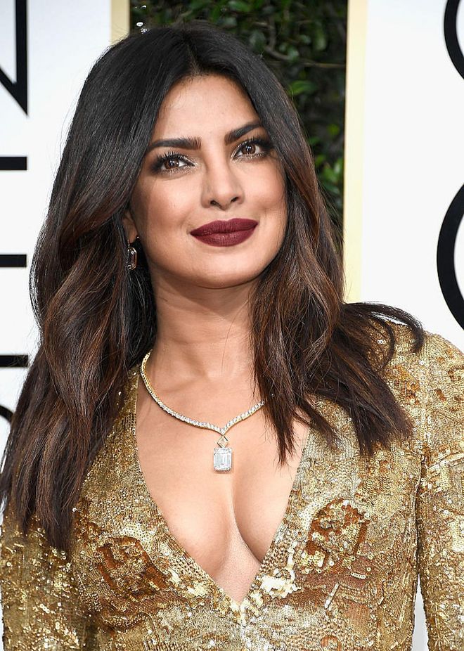 Deep red lips + killer decollete = super sex appeal for Priyanka Chopra.

Photo: Getty Images