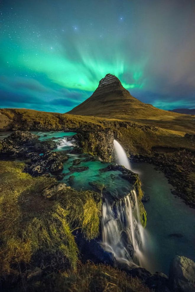 The beauty of Kirkjufell Mountain is in its nearly symmetrical shape and freestanding location—which is probably why it's the most photographed mountain in Iceland. It's also a particularly beautiful spot to watch the Northern Lights when they're active from October to March. Photo: Getty