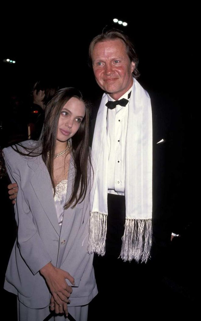 Nice shoulder pads, Angie! Jolie sported an oversized lavender business suit for the premiere of Tru in 1991 alongside her dad Jon Voight.