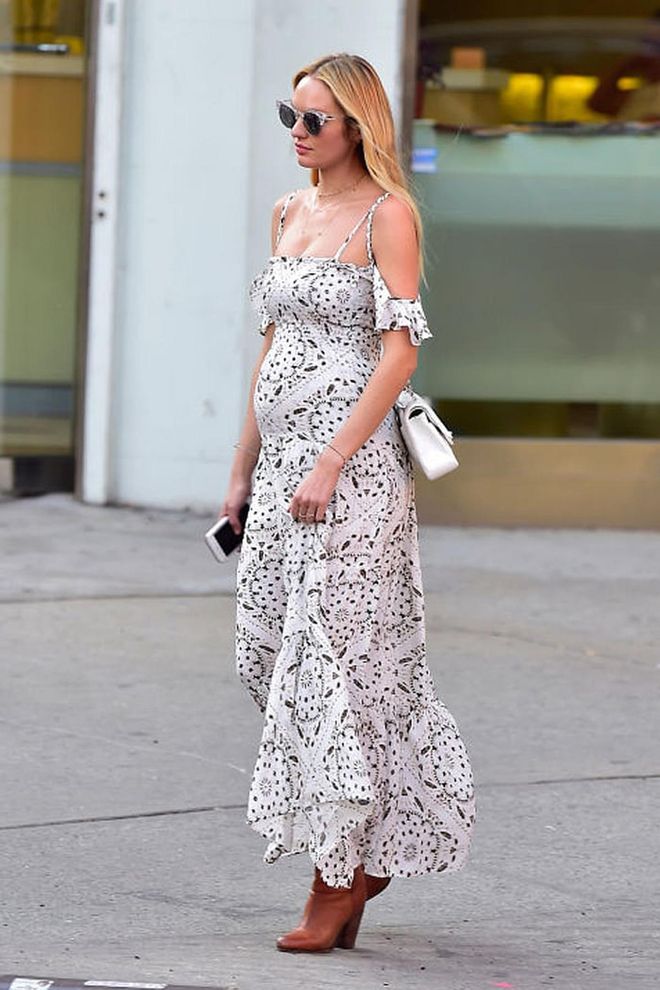 A pregnant Candice Swanepoel wore a mock-Broderie Anglaise dress when out and about in New York. Photo: Getty