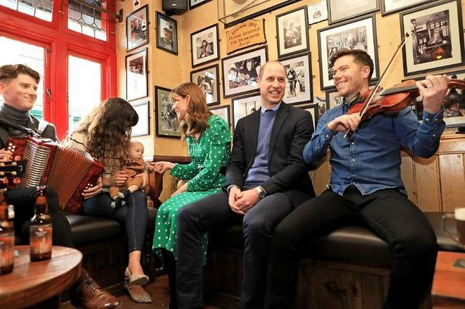 The duke and duchess sit among musicians while visiting Tig Coili, a traditional Irish pub.

Photo: Getty