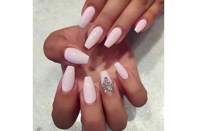 BEST FOR: Acrylic nail enthusiasts.
BOTTOM LINE: This long and slim shape is squared off at the tip resembling a coffin or ballerina slipper. Meticulous salon upkeep is crucial.
WEAR IT WITH: Pale neutrals or simple nail art.
@bellasnailsandspa