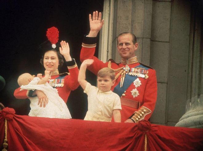 Baby's first balcony appearance! A newborn Prince Edward appears on the Buckingham Palace balcony during Trooping the Colour. His older brother Andrew waves at the crowd with their parents.
Photo: Getty 