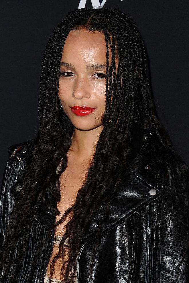 A bright red lipstick paired perfectly with Kravitz's black leather jacket.
