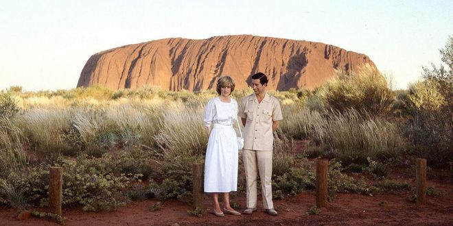 Standing in front of Ayers Rock with Prince Charles during the royal visit to Australia. Photo: Getty