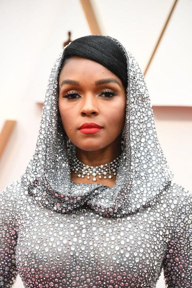 The only beauty moment capable of holding its own against a hooded dress dripping in crystals is a bold red lip. Nobody pulls off the look better than Janelle Monae.

Photo: Steve Granitz / Getty