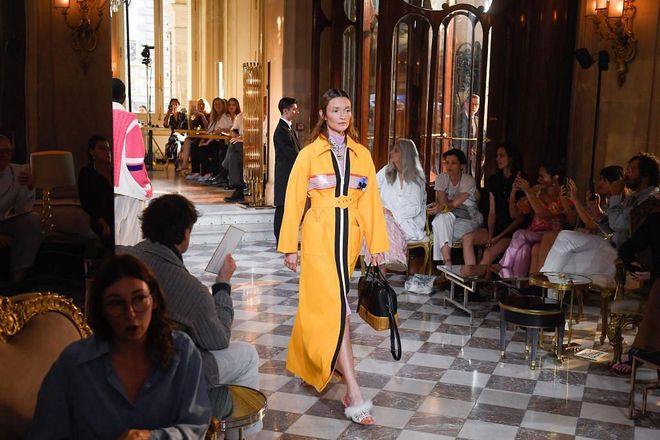 The model wears a jaw-dropping, floor length coat.

Photo: Getty
