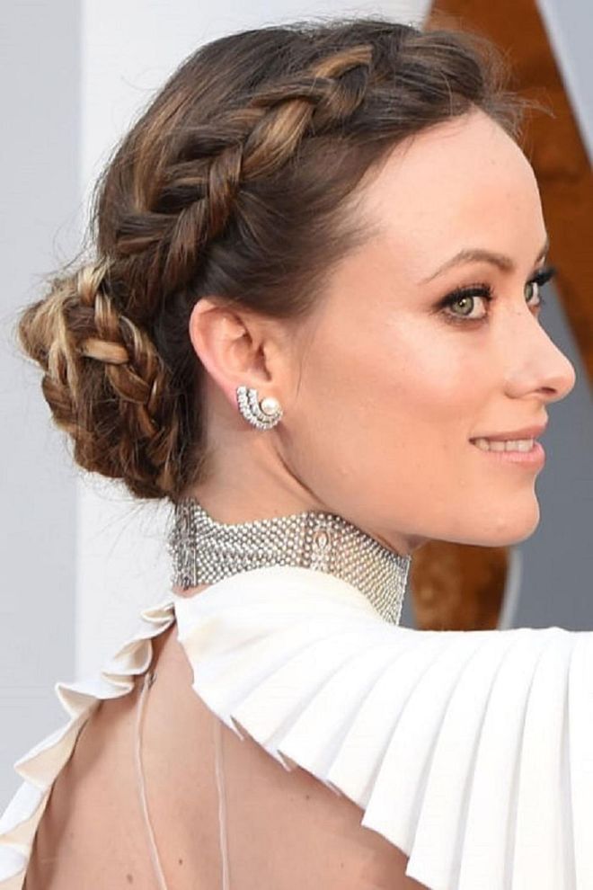 Olivia Wilde impressed at the 2016 Oscars wearing an elegant white gown with a chunky braided crown that twisted into a low bun at the back of her head. This style is perfect for drawing attention to statement necklaces and backless dresses, as demonstrated to particular effect by Wilde. Photo: Getty 