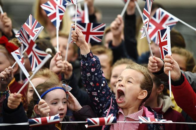 Crowds of very enthusiastic children greeted the royals in town. Photo: Getty