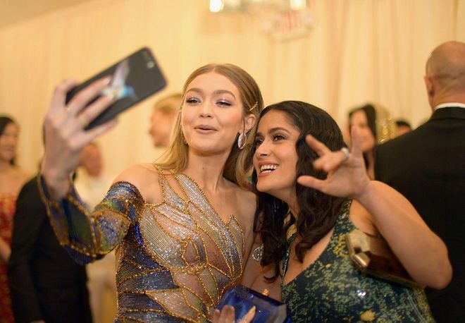 Another candid selfie moment caught on camera, this time with Gigi and Salma. Photo: Getty 