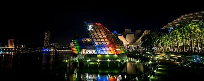 The glass facade of Louis Vuitton's Island Maison at Marina Bay Sands was dressed up in rainbow hues
