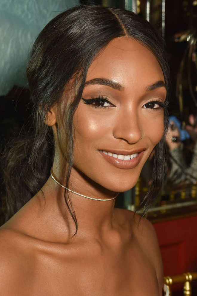 Queen of the cat eye, model Jourdan Dunn, offsets an inky swipe of liner with fluttery lashes and bold brows.