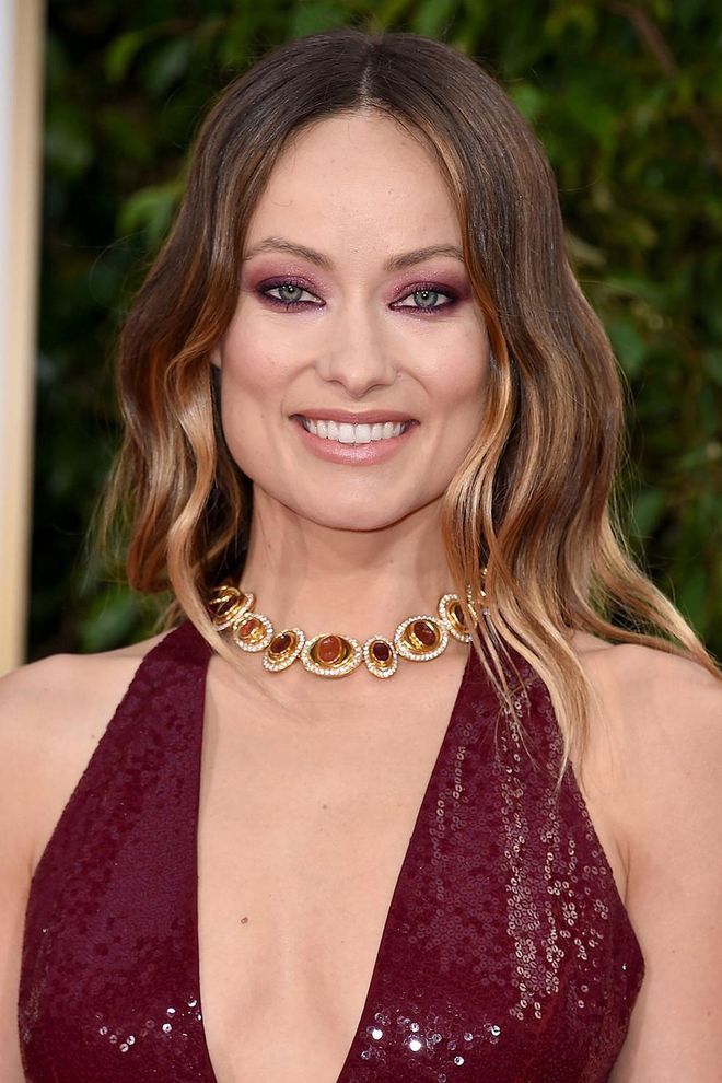 Plum make-up is surprisingly flattering, as Olivia Wilde demonstrates, pairing her colourful eye make-up with a nude lip. Try Huda Beauty's Mauve Obsessions Palette to try the trend. Photo: Getty