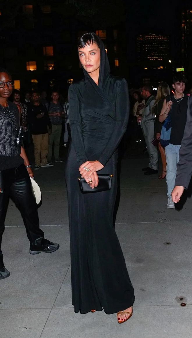 Katie Holmes wearing a hooded wrap gown by Tom Ford at the Tom Ford 2023 spring show in New York. Photo: Gotham
