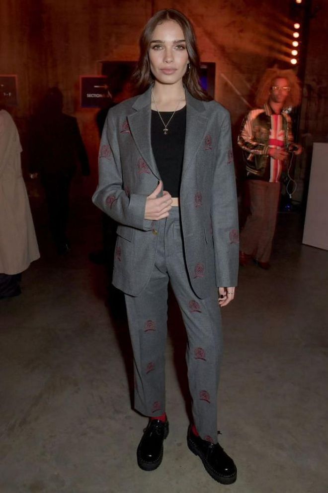 Hana Cross attended the Tommy Hilfiger show in an embroidered grey suit.

Photo: David M. Bennet / Getty