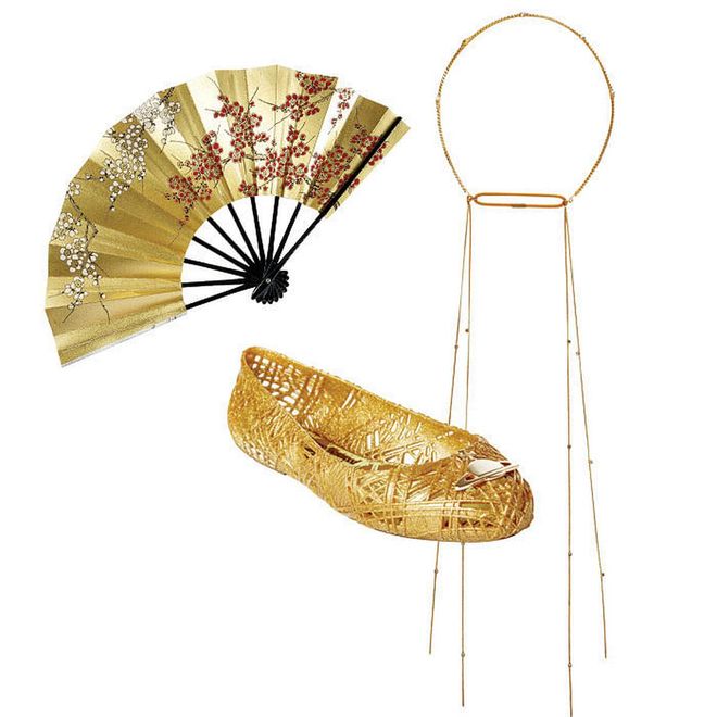 All that glitters is indeed gold when it comes to occasion dressing. Layer on the gilt in elegant fashion by stacking dainty necklaces or keep cool with a hand-painted metallic fan. Then, slip on a pair of shiny pumps to finish the look with finesse. (Fan, $46, Patch
Magic. Chain headpiece, $400, Jennifer Behr at Belle & Tulle Bridal. Ballerina flat, $195, Vivienne Westwood Anglomania + Melissa at TYAN)