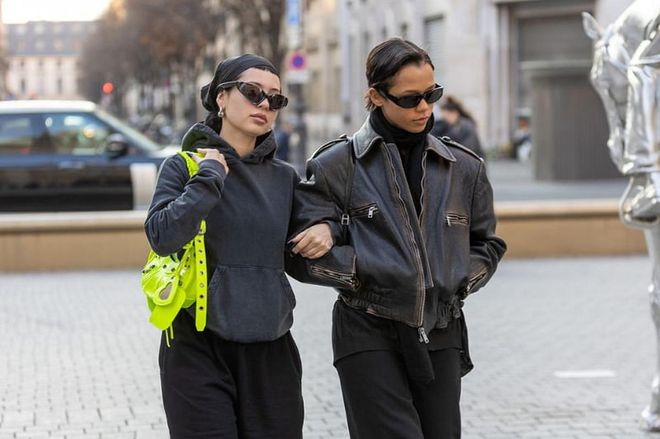 Alexa Demie and Taylor Russell arm in arm at Paris Fashion Week this past March
