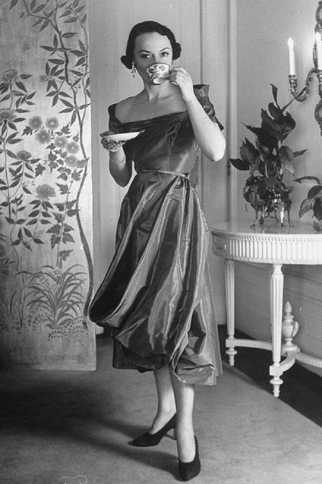 A model posing in a Ceil Chapman cocktail dress.

Photo: Getty