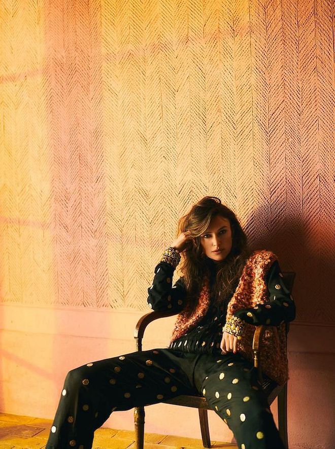 Embroidered silk jacket with embellished cuffs, matching trousers, embellished wool gilet, all Chanel. White gold, rock crystal and diamond earrings, from a selection, Chanel Fine Jewellery. Photo: Boo George for Harper's BAZAAR)
