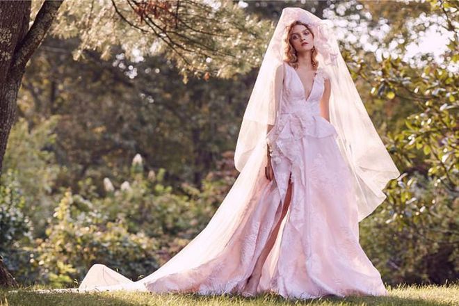 Move away from the usual whites and embrace wedding dresses in delicate shades of pastel, such as in Marchesa’s first ever blush pink gown, Vera Wang’s baby blue tulle gown, or in quieter pops of colour, such as with Carolina Herrera’s lace gown wrapped in a pastel green chiffon sash.