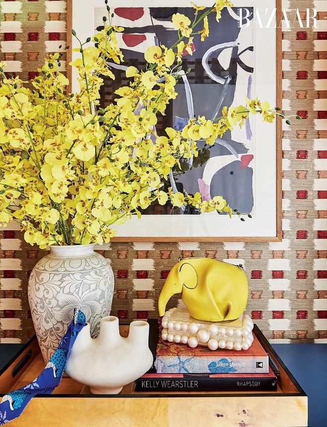 Step into Long’s apartment and be greeted by a Jacques Nestlé painting purchased in Paris and a large vase her mother got in Korea when she was a child. Amongst these treasures are a LOEWE Elephant bag, a Cult Gaia clutch and an Hermès Twilly scarf.